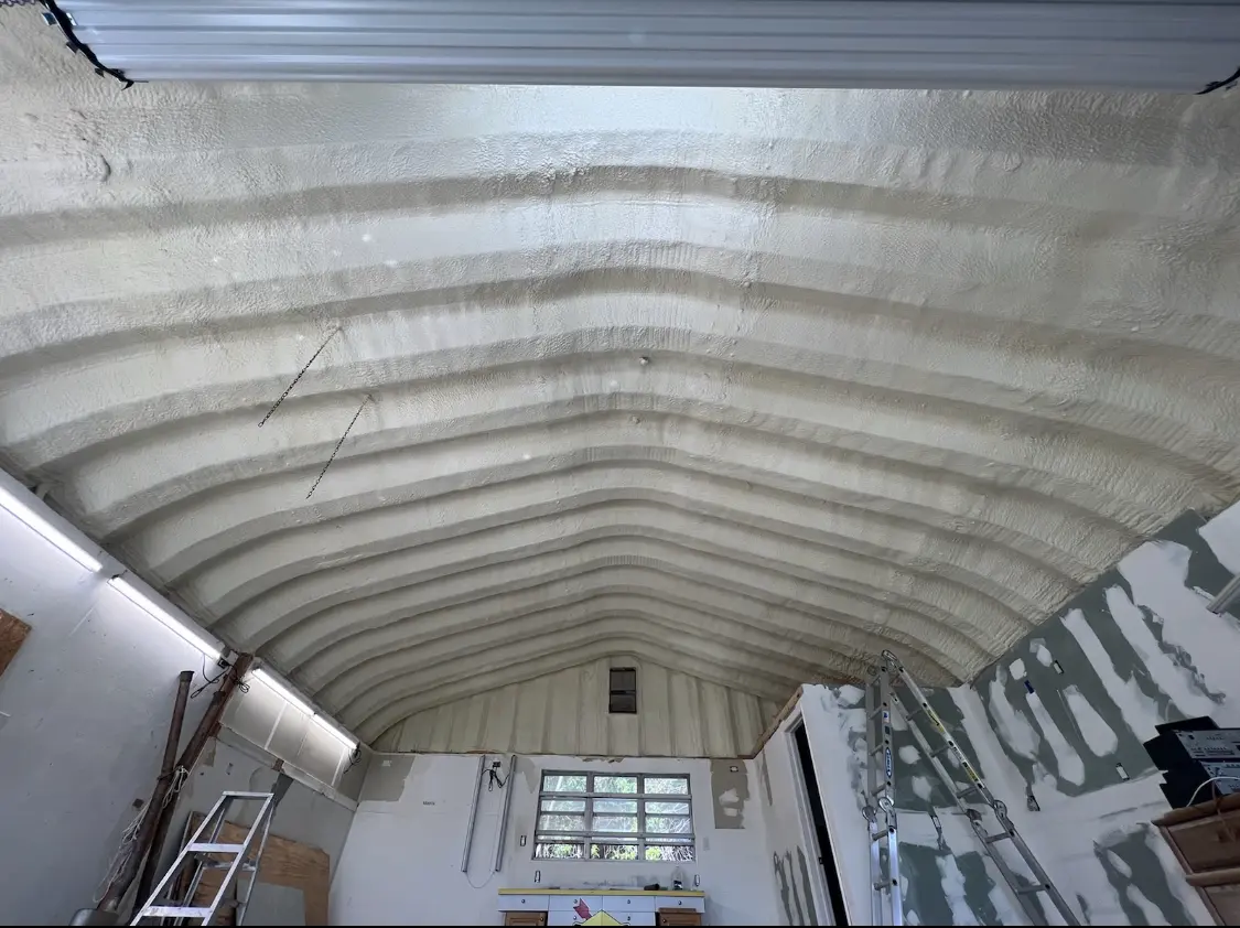 Spray polyurethane foam applied to the underside of a metal roof deck in Blaine